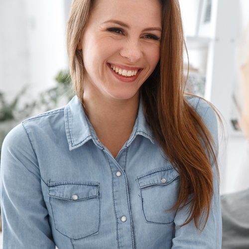 Happy woman smiling in therapy session