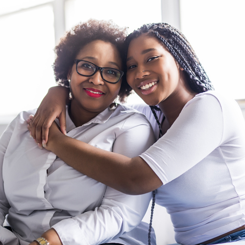 happy mother and daughter hugging