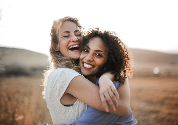 Two female friends having fun in summer.