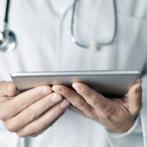 Doctor reading an ipad