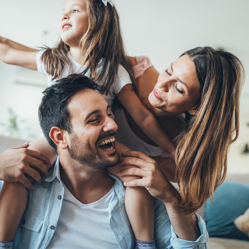 Happy family with a father mother and young daughter