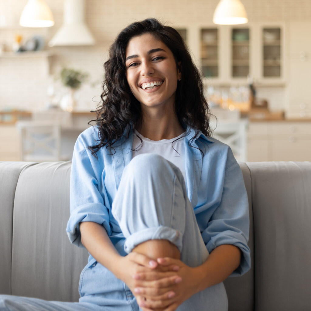 Portrait of young brunette woman smiling